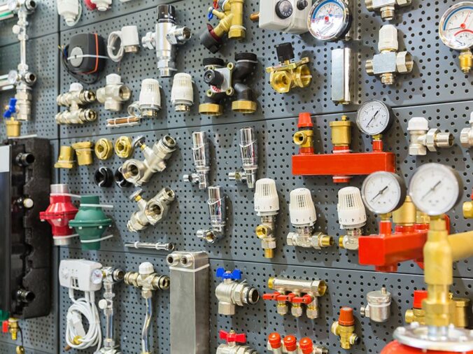 Brass and steel plumbing fittings and fixtures in a plumbing supply store