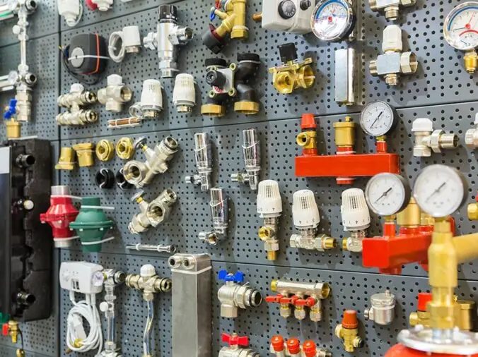 Brass and steel plumbing fittings and fixtures in a plumbing supply store