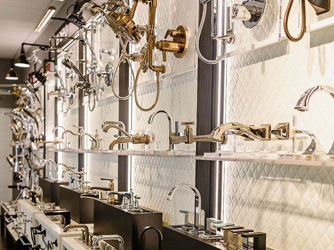 Various faucets with different finishes at Hughes Supply Greenville