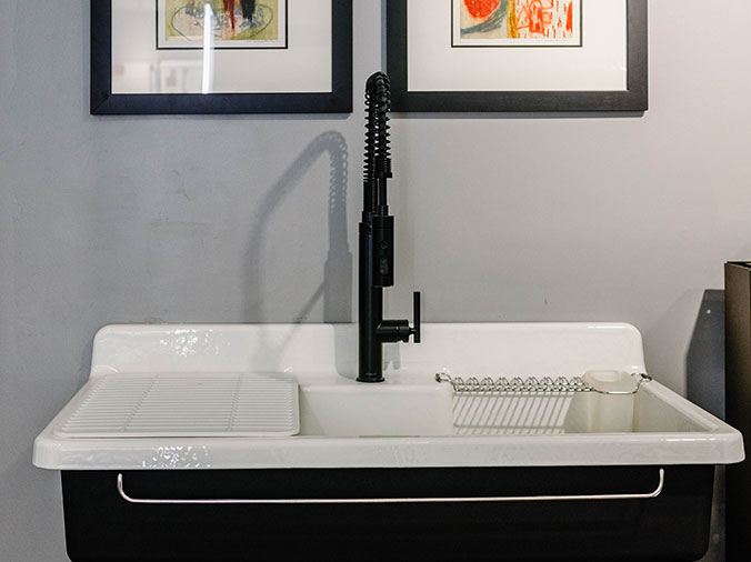 Kitchen sink with black faucet at Hughes Supply Greenville