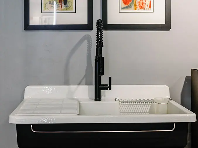 Kitchen sink with black faucet at Hughes Supply Greenville